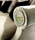 Белый кожаный диван с декоративными вставками