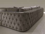 Серый модульный диван с глянцевыми панелями и каретной стяжкой