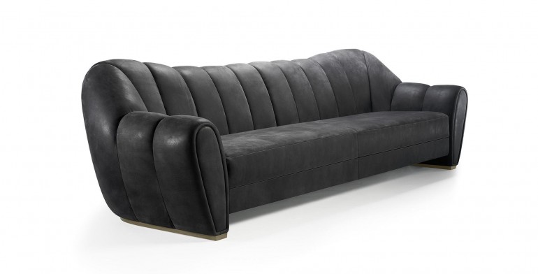 Кожаный диван графитового оттенка со стеганой спинкой и подлокот