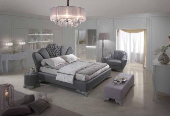 Кровать с фигурным изголовьем в кожаной обивке на резных металлических ножках - pma/093