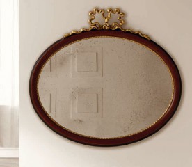 Элегантное овальное зеркало в темно-коричневой раме с резным золотым бантом - msvgf/0112