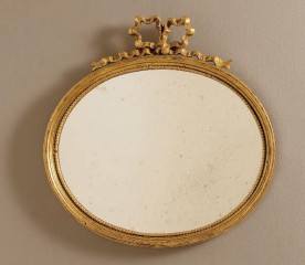 Овальное золотистое зеркало, расположенное горизонтально, с резным бантом - msvgf/0109